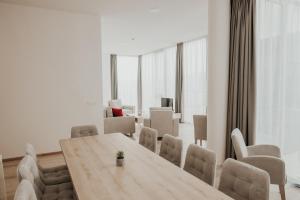 a conference room with a wooden table and chairs at Aparthotel Centar Sarajevo in Sarajevo