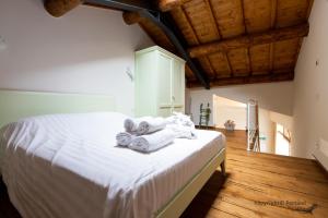 Säng eller sängar i ett rum på Portami in Collina