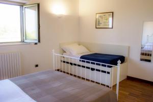 Postel nebo postele na pokoji v ubytování B&B Valleluna