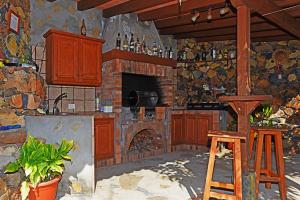 a painting of a kitchen with a fireplace at Villa La Hoya in Tijarafe