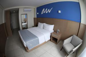 Cama ou camas em um quarto em Real Classic Bahia Hotel