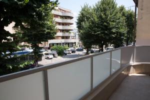 a balcony with a view of a street at Boutique Hotel Enia in Prato