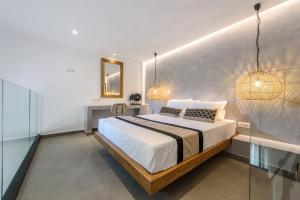 Postel nebo postele na pokoji v ubytování Aggello Boutique Hotel