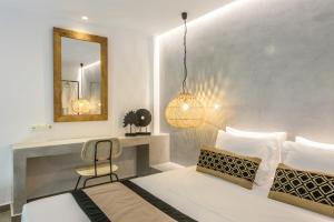 Postel nebo postele na pokoji v ubytování Aggello Boutique Hotel