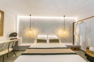 Postel nebo postele na pokoji v ubytování Aggello Boutique Hotel
