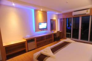 Ένα ή περισσότερα κρεβάτια σε δωμάτιο στο Kitlada Hotel Udonthani