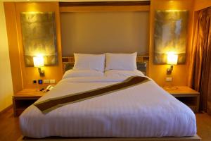 Ένα ή περισσότερα κρεβάτια σε δωμάτιο στο Kitlada Hotel Udonthani