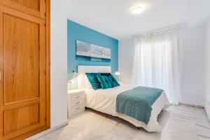 Posteľ alebo postele v izbe v ubytovaní Soho Riverside Suite Málaga