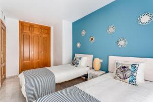 Posteľ alebo postele v izbe v ubytovaní Soho Riverside Suite Málaga