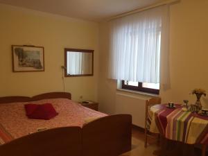 Ein Bett oder Betten in einem Zimmer der Unterkunft Apartment Villa Ana