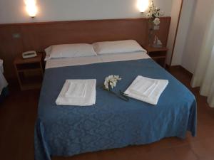 Postel nebo postele na pokoji v ubytování Hotel Leuco'