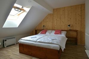Postel nebo postele na pokoji v ubytování CASTLE AREA BLATNÁ