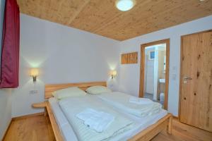 Posteľ alebo postele v izbe v ubytovaní Residenz Wildkogelbahnen Top 10