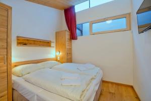 Posteľ alebo postele v izbe v ubytovaní Residenz Wildkogelbahnen Top 10