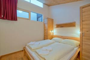 Posteľ alebo postele v izbe v ubytovaní Residenz Wildkogelbahnen Top 10