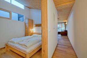 Ein Bett oder Betten in einem Zimmer der Unterkunft Residenz Wildkogelbahnen Top 10
