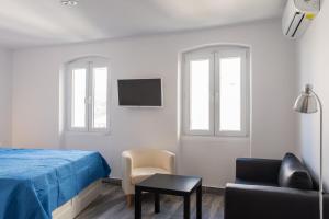 Corfu Downtown Suites TV 또는 엔터테인먼트 센터