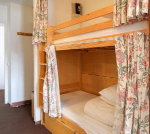 a couple of bunk beds in a room at Spacious Family Apartment, Immeuble Gemeaux in Flaine