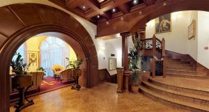 a lobby with an archway and stairs in a building at Historic Boutique Hotel Cattaro in Kotor