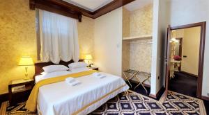 Voodi või voodid majutusasutuse Historic Boutique Hotel Cattaro toas