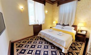 Voodi või voodid majutusasutuse Historic Boutique Hotel Cattaro toas