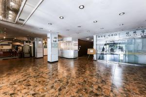 a large room with a hard wood floor and exhibits at Kyungha Spa Hotel in Daejeon