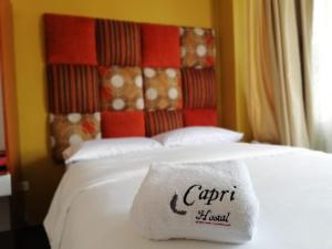 Letto o letti in una camera di Hostal Capri