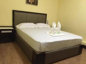 Postel nebo postele na pokoji v ubytování Meaco Royal Hotel - Plaridel