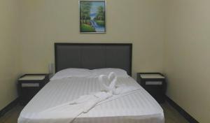 Postel nebo postele na pokoji v ubytování Meaco Royal Hotel - Plaridel
