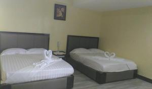 Postel nebo postele na pokoji v ubytování Meaco Royal Hotel - Plaridel