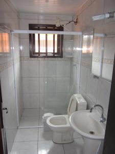 Ett badrum på Casa Oasis Sul Tramandaí