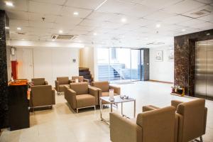 a waiting room with chairs and a table at Sakura Hotel 3 in Hanoi