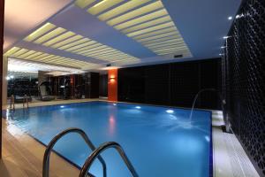 a large swimming pool in a hotel room at Victory Hotel & Spa Istanbul in Istanbul