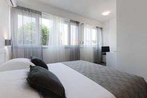 Postel nebo postele na pokoji v ubytování Reza Luxury Apartment