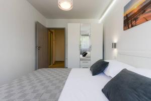 Postel nebo postele na pokoji v ubytování Reza Luxury Apartment