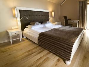 Łóżko lub łóżka w pokoju w obiekcie Hotel Remes
