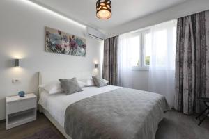 Postel nebo postele na pokoji v ubytování Reza Luxury Apartment