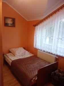 Postel nebo postele na pokoji v ubytování Pokoje Goscinne Bartosz