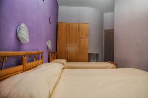 Letto o letti in una camera di Hotel Centrale di Paolo e Cinzia