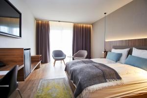 A bed or beds in a room at Hotel Berg by Keflavik Airport
