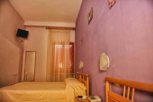 Letto o letti in una camera di Hotel Centrale di Paolo e Cinzia