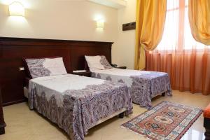 Postel nebo postele na pokoji v ubytování Sammartano Hotels