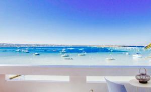 a view of a harbor with boats in the water at FORMENTERA WHITE ESTUDIOS in La Savina