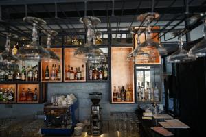 a bar with many bottles of alcohol on the wall at Riva's Moda in Istanbul