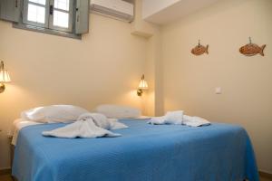 Cama ou camas em um quarto em villa aneme Spetses
