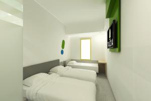 Postel nebo postele na pokoji v ubytování POP! Hotel Festival Citylink