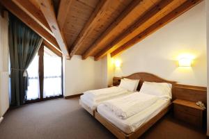 מיטה או מיטות בחדר ב-Hotel Montana