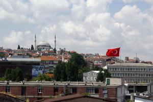 a view of a city with a red flag at Marpalace Hotel in Istanbul