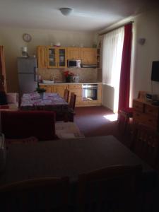 A kitchen or kitchenette at Guest House Privat Pod Lesom