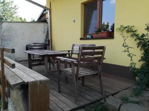 a patio with two chairs and a table and a window at Ing. Martin Čech Kielar in Hlohovec